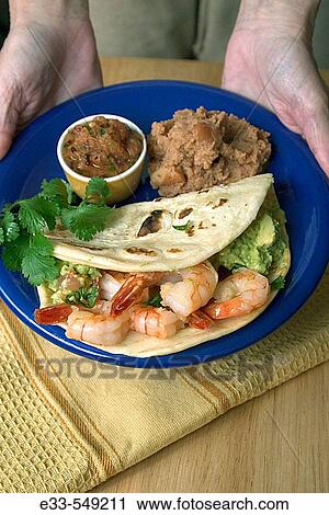Mexican/Baja California style food - Shrimp taco with salsa and refried beans View Large Photo Image Stock Image - Mexican/Baja California style food - Shrimp taco with salsa and refried beans. Fotosearch
