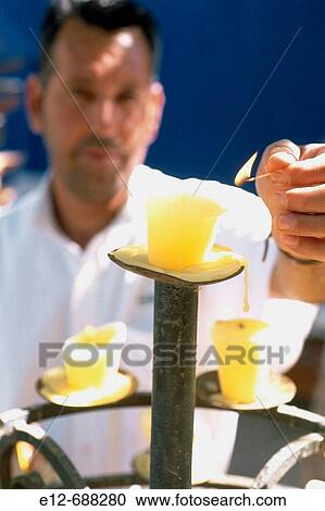 Stock Image - Mexico, Baja California. Village Todos Santos. Hotel California, Where the legend says.? The Eagles? found their inspiration for the famous song. Candles at the sunset on the terrace.. Fotosearch