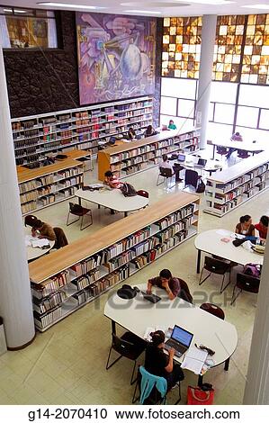 Mexico, Mexico City, DF, D. F., Distrito Federal, Ciudad Universitaria, UNAM, university, education, Biblioteca Central, library, interior, Hispanic, student, teen, man, woman, reading room, studying, laptop, desk, book, overhead view, bookshelf,. View Large Photo Image Stock Image - Mexico, Mexico City, DF, D. F., Distrito Federal, Ciudad Universitaria, UNAM, university, education, Biblioteca Central, library, interior, Hispanic, student, teen, man, woman, reading room, studying, laptop, desk, book, overhead view, bookshelf,.. Fotosearch