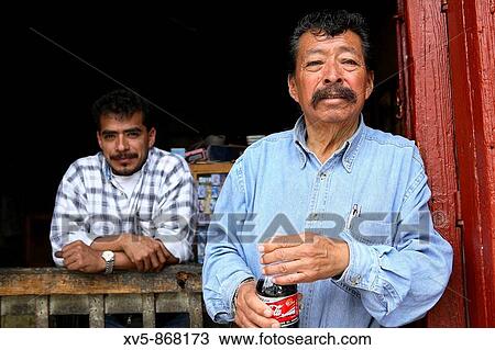 Mexico. Michoacan. Pazcuaro. Two mexican men at the door shop. View Large Photo Image Stock Image - Mexico. Michoacan. Pazcuaro. Two mexican men at the door shop.. Fotosearch