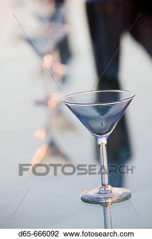 Stock Image - MEXICO-Pacific Coast-GUERRERO-Ixtapa: Playa del Palmar / Beachside Bar Cocktail Glass / Dusk. Fotosearch
