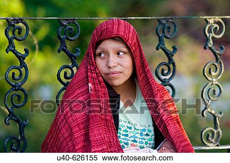 Mexico, Puerto Vallarta. Young woman sitting on sidewalk View Large Photo Image Stock Photography - Mexico, Puerto Vallarta. Young woman sitting on sidewalk. Fotosearch