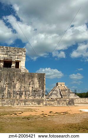 MEXICO, YUCATAN PENINSULA, CHICHEN ITZA ARCHAEOLOGICAL ZONE, BALL COURT, EL CASTILLO (CASTLE) IN BACKGROUND. View Large Photo Image Stock Image - MEXICO, YUCATAN PENINSULA, CHICHEN ITZA ARCHAEOLOGICAL ZONE, BALL COURT, EL CASTILLO (CASTLE) IN BACKGROUND.. Fotosearch