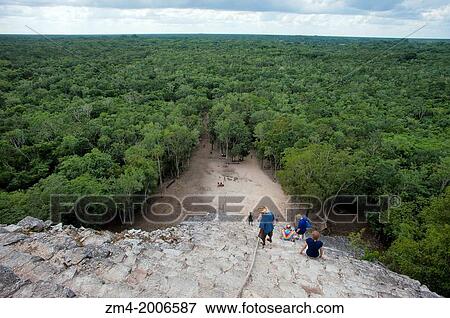 MEXICO, YUCATAN PENINSULA, NEAR CANCUN, MAYA RUINS OF COBA, NOHOCH MUT GROUP, TOURISTS CLIMBING CASTLE, PYRAMID. View Large Photo Image Stock Photo - MEXICO, YUCATAN PENINSULA, NEAR CANCUN, MAYA RUINS OF COBA, NOHOCH MUT GROUP, TOURISTS CLIMBING CASTLE, PYRAMID.. Fotosearch