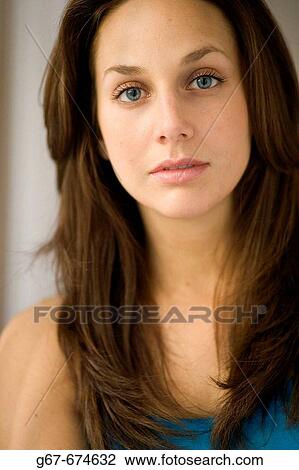 Mid 20s blue eyed brunette caucasian woman poses for portrait, head and shoulders, photograph. View Large Photo Image Stock Image - Mid 20s blue eyed brunette caucasian woman poses for portrait, head and shoulders, photograph.. Fotosearch