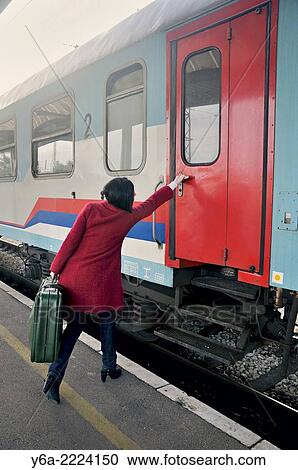 Mid adult woman late for the train. View Large Photo Image Stock Image - Mid adult woman late for the train.. Fotosearch