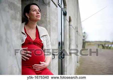 Middel-aged woman, expecting her first child, after being pregnant for 38 weeks. View Large Photo Image Stock Image - Middel-aged woman, expecting her first child, after being pregnant for 38 weeks.. Fotosearch