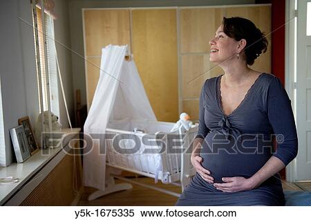 Middel-aged woman, expecting her first child, after being pregnant for 38 weeks. View Large Photo Image Stock Photography - Middel-aged woman, expecting her first child, after being pregnant for 38 weeks.. Fotosearch