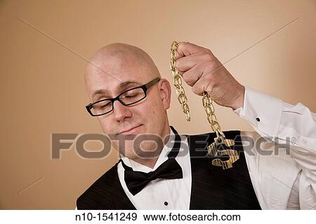 Middle-age bald man holding a chain with a US dollar symbol View Large Photo Image Stock Photo - Middle-age bald man holding a chain with a US dollar symbol. Fotosearch
