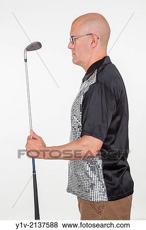 Stock Photo - Middle-age bald man holding a golf club.. Fotosearch