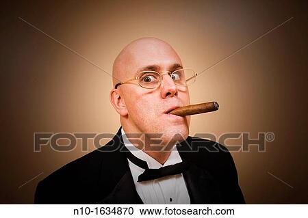 Middle-age bald man in a tuxedo, smoking a cigar View Large Photo Image Stock Image - Middle-age bald man in a tuxedo, smoking a cigar. Fotosearch