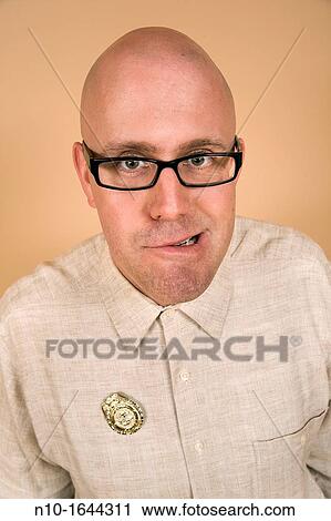 Middle-age bald man wearing a badge View Large Photo Image Stock Image - Middle-age bald man wearing a badge. Fotosearch