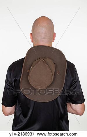 Stock Photo - Middle-age bald man wearing a hat.. Fotosearch