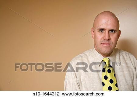 Middle-age bald man wearing a tie View Large Photo Image Stock Image - Middle-age bald man wearing a tie. Fotosearch
