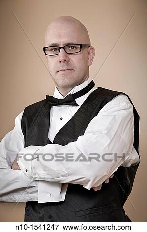 Middle-age bald man wearing a tuxedo View Large Photo Image Stock Photo - Middle-age bald man wearing a tuxedo. Fotosearch