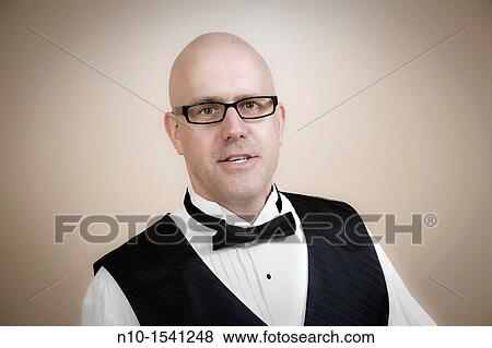 Middle-age bald man wearing a tuxedo View Large Photo Image Stock Photo - Middle-age bald man wearing a tuxedo. Fotosearch