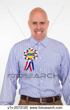 Middle-age bald man wearing a "WINNER" badge. View Large Photo Image Stock Image - Middle-age bald man wearing a "WINNER" badge.. Fotosearch