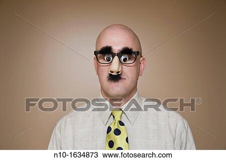 Middle-age bald man wearing funny glasses View Large Photo Image Stock Image - Middle-age bald man wearing funny glasses. Fotosearch
