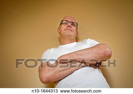 Middle-age bald man wearing glasses View Large Photo Image Stock Image - Middle-age bald man wearing glasses. Fotosearch