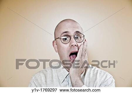 Stock Photo - Middle-age bald man wearing glasses. Fotosearch