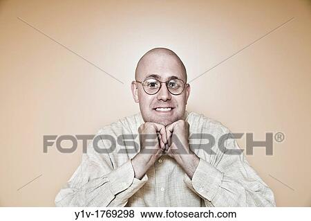 Middle-age bald man wearing glasses View Large Photo Image Stock Photo - Middle-age bald man wearing glasses. Fotosearch