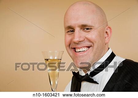 Middle-age bald man with a glass of champagne View Large Photo Image Stock Image - Middle-age bald man with a glass of champagne. Fotosearch