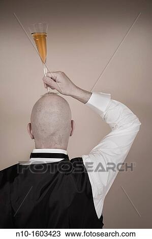 Middle-age bald man with a glass of champagne View Large Photo Image Stock Image - Middle-age bald man with a glass of champagne. Fotosearch