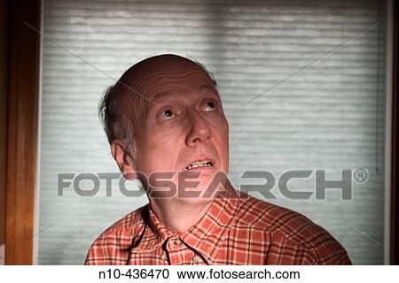 Middle-age balding man looking grim. View Large Photo Image Stock Image - Middle-age balding man looking grim.. Fotosearch