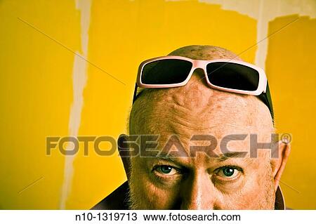 Middle-age balding man with sunglasses on his head View Large Photo Image Stock Image - Middle-age balding man with sunglasses on his head. Fotosearch