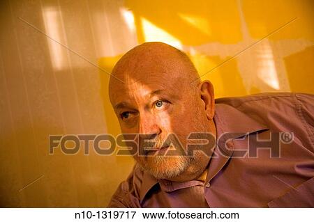 Middle-age man being lit by sunlight View Large Photo Image Stock Photo - Middle-age man being lit by sunlight. Fotosearch