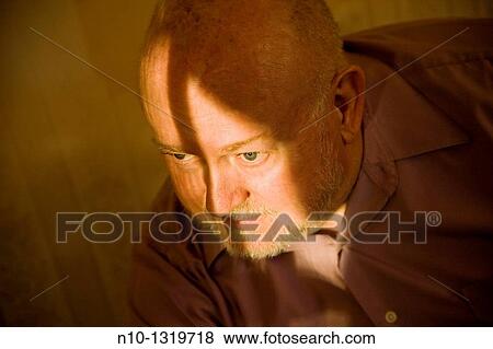 Middle-age man being lit by sunlight View Large Photo Image Stock Photo - Middle-age man being lit by sunlight. Fotosearch