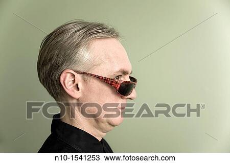 Middle-age man wearing sunglasses View Large Photo Image Stock Image - Middle-age man wearing sunglasses. Fotosearch