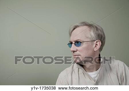 Middle-age man wearing sunglasses View Large Photo Image Stock Photo - Middle-age man wearing sunglasses. Fotosearch