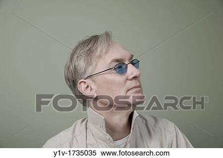 Middle-age man wearing sunglasses View Large Photo Image Stock Photography - Middle-age man wearing sunglasses. Fotosearch