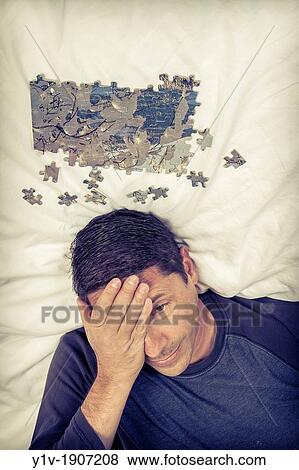 Middle-age man with a puzzle View Large Photo Image Stock Photo - Middle-age man with a puzzle. Fotosearch