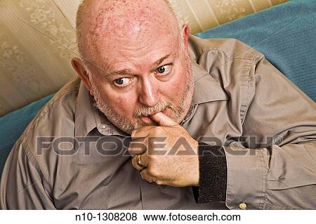 Middle-age man with his thumb in his mouth View Large Photo Image Stock Photo - Middle-age man with his thumb in his mouth. Fotosearch