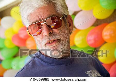 Middle-age man working in a game booth at a carnival. View Large Photo Image Stock Photography - Middle-age man working in a game booth at a carnival.. Fotosearch
