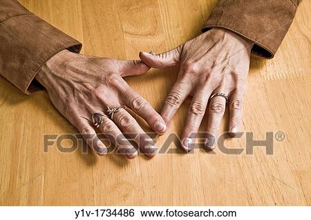 Stock Photograph - Middle-age woman's hands. Fotosearch