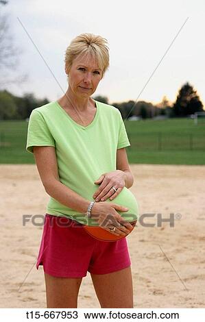 Middle aged blond woman reminiscing pregnancy and feeling sad View Large Photo Image Stock Image - Middle aged blond woman reminiscing pregnancy and feeling sad. Fotosearch