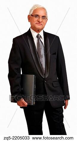 Middle aged business man in suit and holding a laptop, Pune, India. View Large Photo Image Stock Image - Middle aged business man in suit and holding a laptop, Pune, India.. Fotosearch