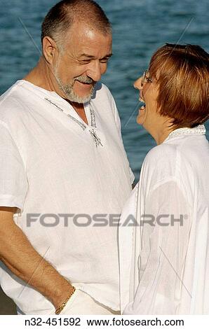 Middle-aged couple on the beach View Large Photo Image Stock Image - Middle-aged couple on the beach. Fotosearch