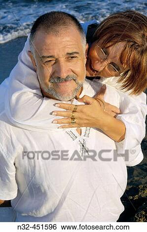 Middle-aged couple on the beach View Large Photo Image Stock Photograph - Middle-aged couple on the beach. Fotosearch