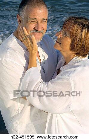 Middle-aged couple on the beach View Large Photo Image Stock Photography - Middle-aged couple on the beach. Fotosearch