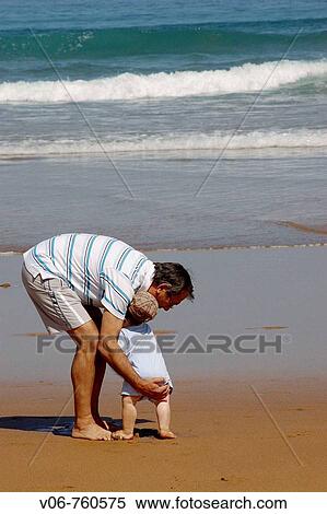 Middle-aged man and baby on the beach View Large Photo Image Stock Photography - Middle-aged man and baby on the beach. Fotosearch