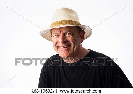 Stock Image - Middle-aged man wearing a straw fedora. Fotosearch