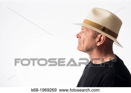 Middle-aged man wearing a straw fedora View Large Photo Image Stock Photo - Middle-aged man wearing a straw fedora. Fotosearch
