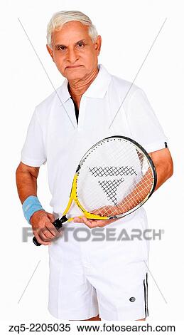 Middle aged man with tennis racquet in hand, Pune, India. View Large Photo Image Stock Photography - Middle aged man with tennis racquet in hand, Pune, India.. Fotosearch