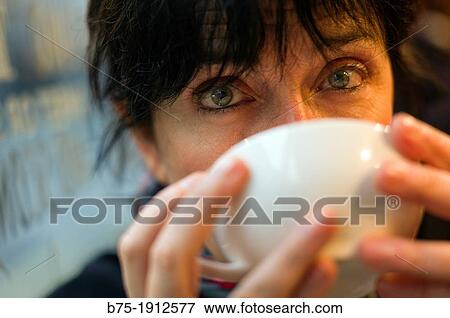 middle-aged woman drinking a cup of tea View Large Photo Image Stock Photo - middle-aged woman drinking a cup of tea. Fotosearch