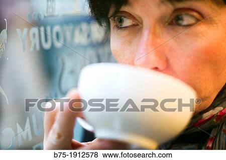 middle-aged woman drinking a cup of tea View Large Photo Image Stock Photo - middle-aged woman drinking a cup of tea. Fotosearch