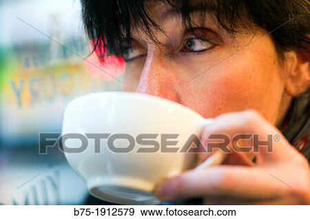 middle-aged woman drinking a cup of tea View Large Photo Image Stock Photo - middle-aged woman drinking a cup of tea. Fotosearch